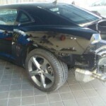 Photographs of a 2014 Chevrolet Camaro that was in an accident and repaired by Elite Paint & Body Shop in West Palm Beach Florida